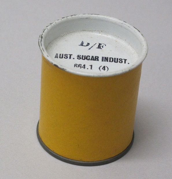 Metal cannister, cylindrical in shape, with a metal lid to store filmstrips. 